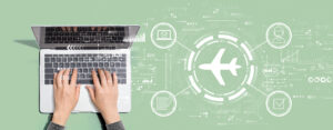 Flight ticket booking concept with person using laptop computer
